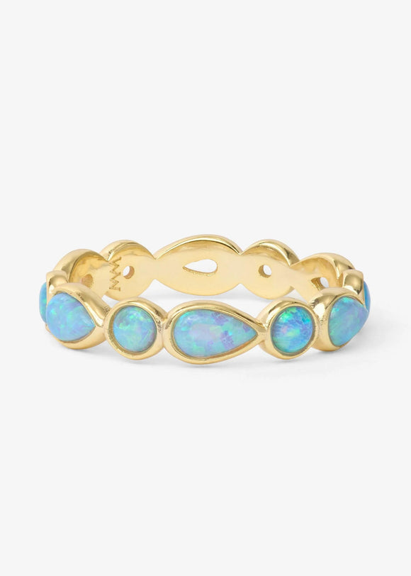Gold ring with opal stones on a white background
