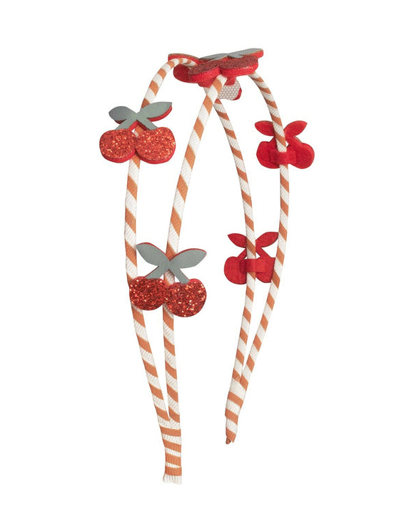 A double headband with striped gingham ribbon and cherry decorations in red and white colors.
