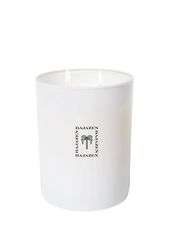 White candle with a brand logo on a white background