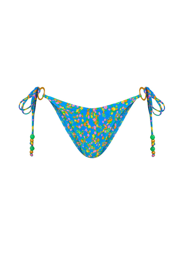 Blue bikini bottom with colorful floral pattern and green beads on straps on a white background