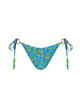 Blue bikini bottom with colorful floral pattern and green beads on straps on a white background