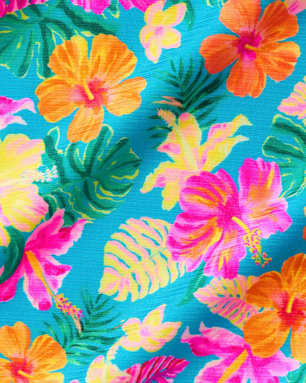 Colorful tropical flower pattern on a blue background