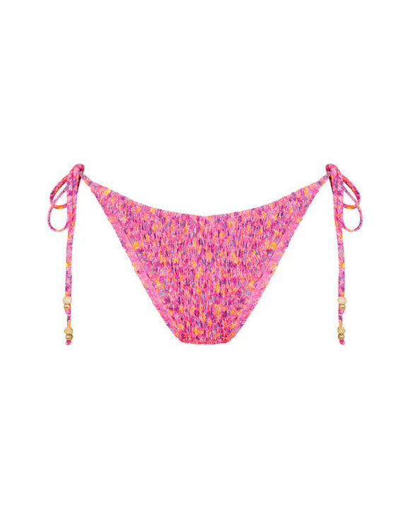 Pink patterned bikini bottom with tie sides on a white background