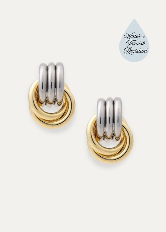 Pair of gold and silver hoop earrings on a white background with 'Water & Fingerprint Resistant' label.